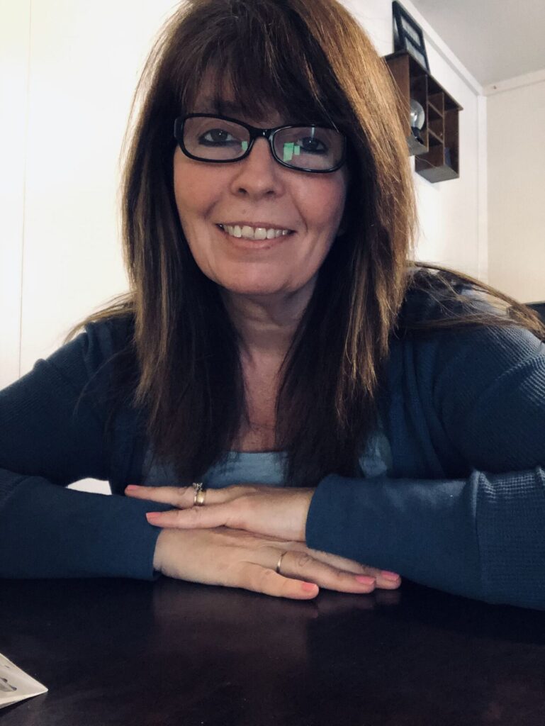A woman smiling at the camera